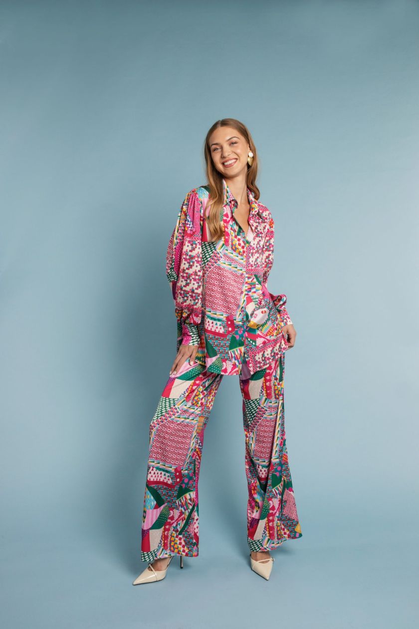 Model wearing the Brigitte Shirt, oversized silk-touch design in one size, front view