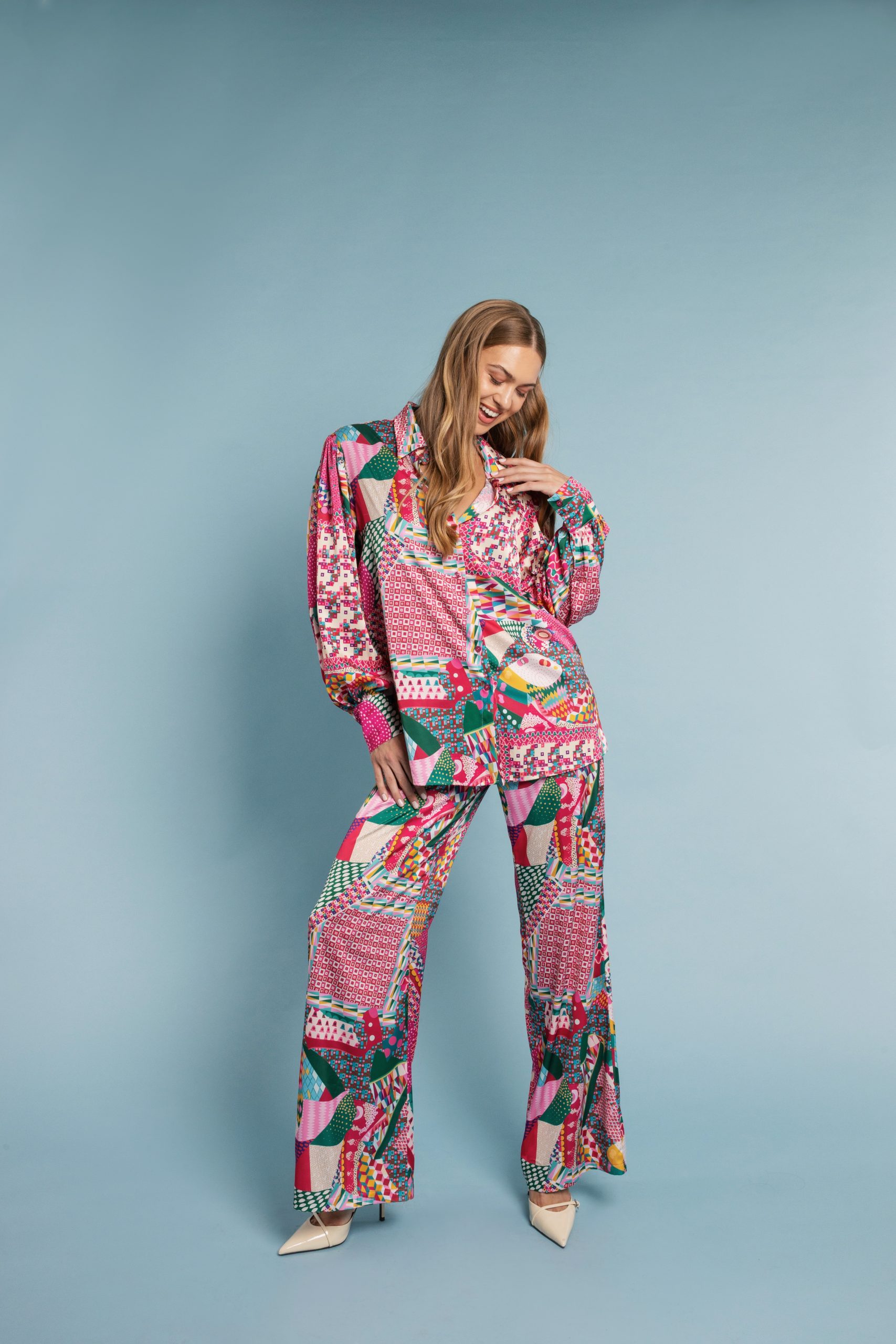 Model wearing the Brigitte Shirt, oversized silk-touch design in one size, front view